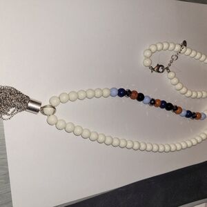 Necklace with white blue brown and black beads